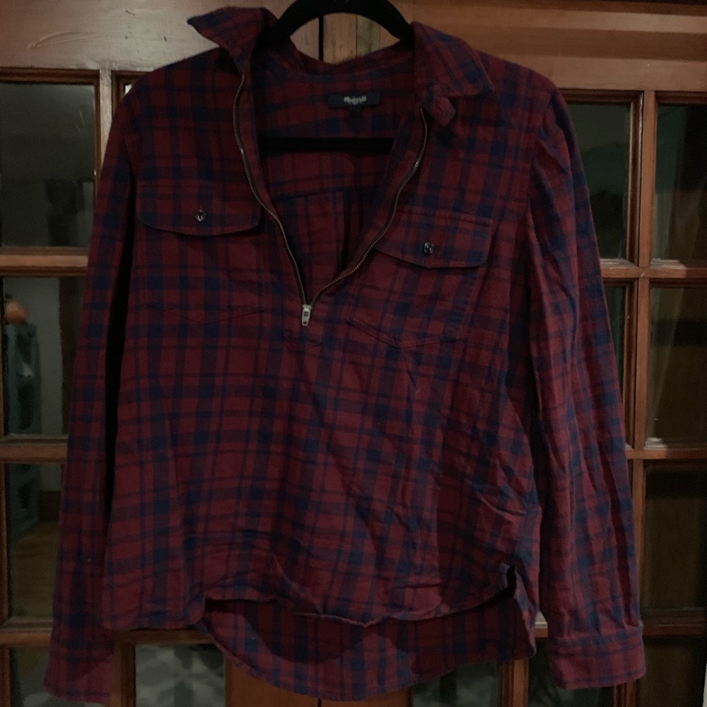 A red and navy half zip flannel